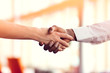 © FS-Stock - Closeup of White and Black shaking hands over a deal