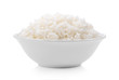 Cooked rice in ceramic bowl on white background