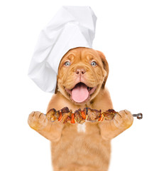 Poster - Funny dog in chef's hat with grilled meat on skewer. isolated on white background