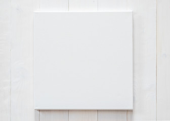 Wall Mural - White blank canvas mockup square size on white wood wall for arts painting and photo hanging interior decoration