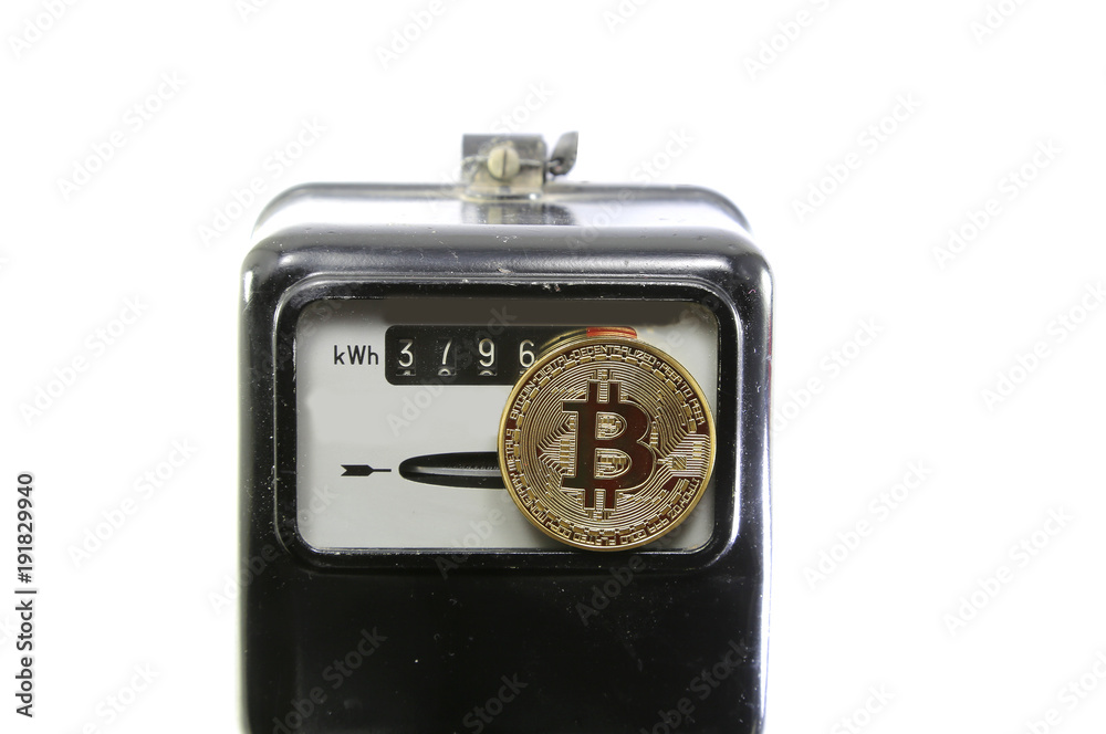 golden BitCoin coin over an analog electric power meter