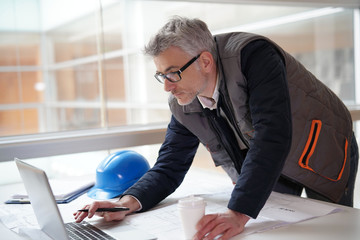 Wall Mural - Architect in office working on building project