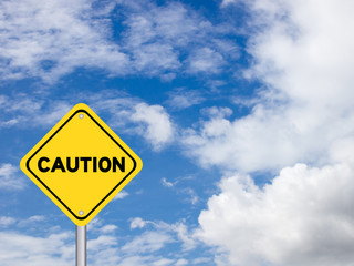 Poster - Yellow transportation sign post with caution word on blue sky with cloud background and have copy space