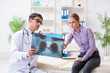 © Elnur - Doctor examining x-ray images of patient