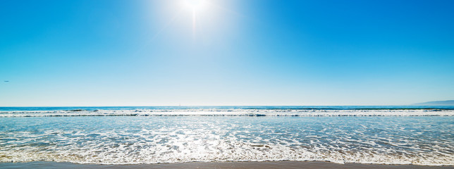 Sun shining over Santa Monica beach on a clear day