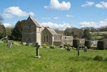 Spring Sunshine On The Picturesque Old Church At Duntisbourne Abbots In The Cotswolds, Gloucestershire, UK