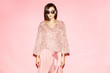 © Sergey Chumakov - fashionable woman in pink clothing on pink background