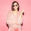 © Sergey Chumakov - young female fashion model in pink total look on pink background