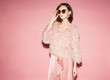 © Sergey Chumakov - attractive stylish woman in pink dress looking left on pink background