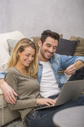 young couple buying on internet, online shopping Poster