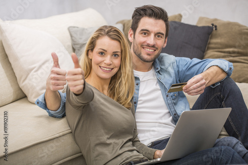 young couple buying on internet, online shopping Poster