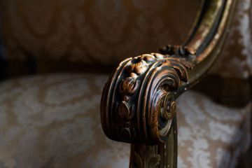 detail of wooden armchair arm