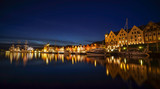 Fototapeta Miasto - A night long exposure photography of Bergen at harbor  with beautiful water reflection