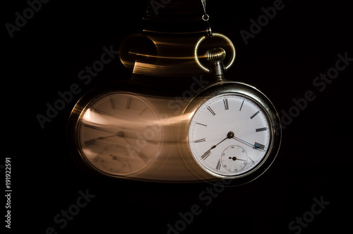 Fotografie, Obraz Swinging Pocket Watch Beckoning You to Look More Closely