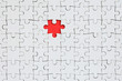 © mehaniq41 - The texture of a white jigsaw puzzle in an assembled state with one missing element forming a red space