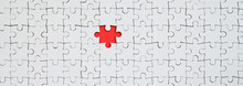 The Texture Of A White Jigsaw Puzzle In An Assembled State With One Missing Element Forming A Red Space