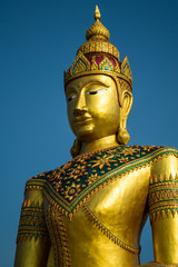 Golden image of buddha thai style on blue sky background