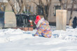 © Sergey_Siberia88 - A child is playing in the snow. A child plays in winter with a view from the spen.