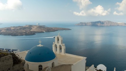 Wall Mural - morning time lapse of the famous three bells in fira on the island of santorini, greece