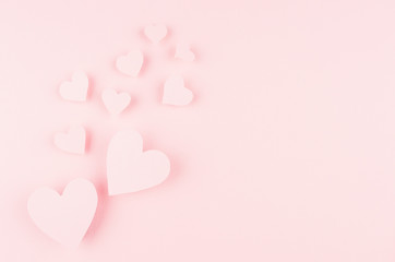 Wall Mural - Valentines day background with hearts flying on pink paper, copy space.