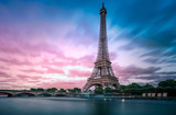 Fototapeta Miasto - Long exposure photographyof the Eiffel Tower from Seine river with evening purple blue sky
