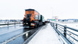 Snowplow at work in vinter time in Denmark