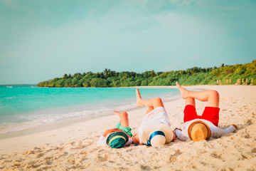 Wall Mural - happy family with child relax having fun on beach