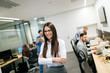 © NDABCREATIVITY - Portrait of successful beautiful businesswoman in office