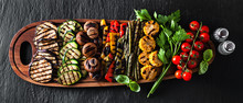 Banner . A Large Wooden Tray With A Summer Snack, Colorful Barbecue Vegetables, Cherry Tomatoes And Greens. Summer Delicious Healthy Food For A Big Company Of People Or Friends