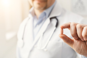 Wall Mural - Pill in doctor's hands closeup