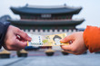 Giving money, Korean won banknotes at Gyeongbokgung Palace,Seoul Korea.