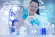 © zinkevych - Cheerful doctor. Pleasant young clever doctor wearing special glasses and standing in a modern laboratory while pouring colorful liquids into special test tubes