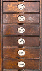 Old wooden filing cabinet with wooden drawers