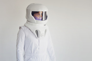 Wall Mural - Astronaut in a helmet looking to the right. Fantastic space suit.