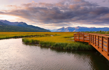 Beautiful sunrise at Potter Marsh Wildlife Viewing Boardwalk, Anchorage, Alaska. Potter Marsh is located at the southern end of the Anchorage Coastal Wildlife Refuge.