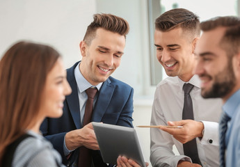 Canvas Print - Team of specialists engaged in work on business project