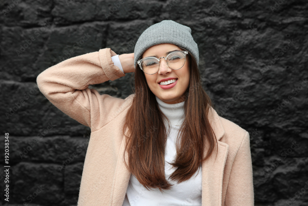 Beautiful smiling woman on dark background