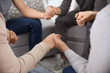 © Africa Studio - Young people holding hands during group therapy, closeup