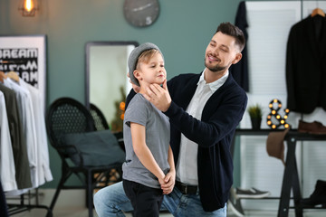 Wall Mural - Stylish father and son, indoors