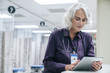 © FS Productions/Blend Images - Doctor using digital tablet in hospital