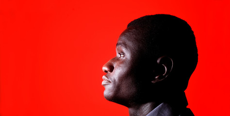 Wall Mural - Portrait of a man on red background