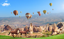 Hot Air Balloons And Two Horses In Cappadocia, Turkey