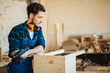© alfa27 - portrait of Young male carpenter in workshop looking at camera