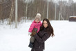 © guardalex - Mom and daughter in winter Park