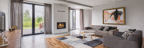 Spacious living room with sofa Tableau sur Toile