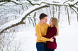 © o_lypa - Young couple hugs in winter forest