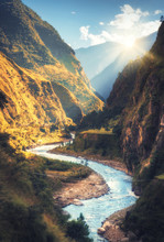Colorful Landscape With High Himalayan Mountains, Beautiful Curving River, Green Forest, Blue Sky With Clouds And Yellow Sunlight At Sunset In Autumn In Nepal. Mountain Valley. Travel In Himalayas