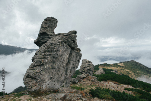 Fotografie, Obraz Strange rocks in mountains in cloudy day