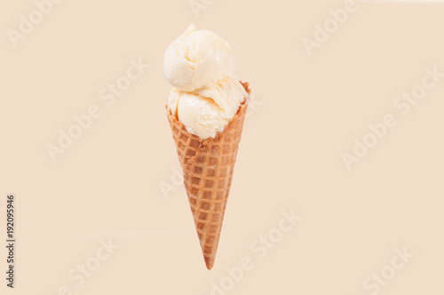 Fotomural Vanilla ice cream cone on white background.