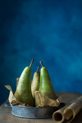 fresh green pears on wooden table